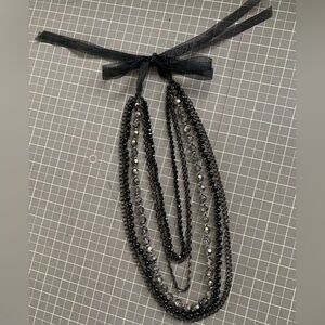Multi-strand necklace with organza tie closure